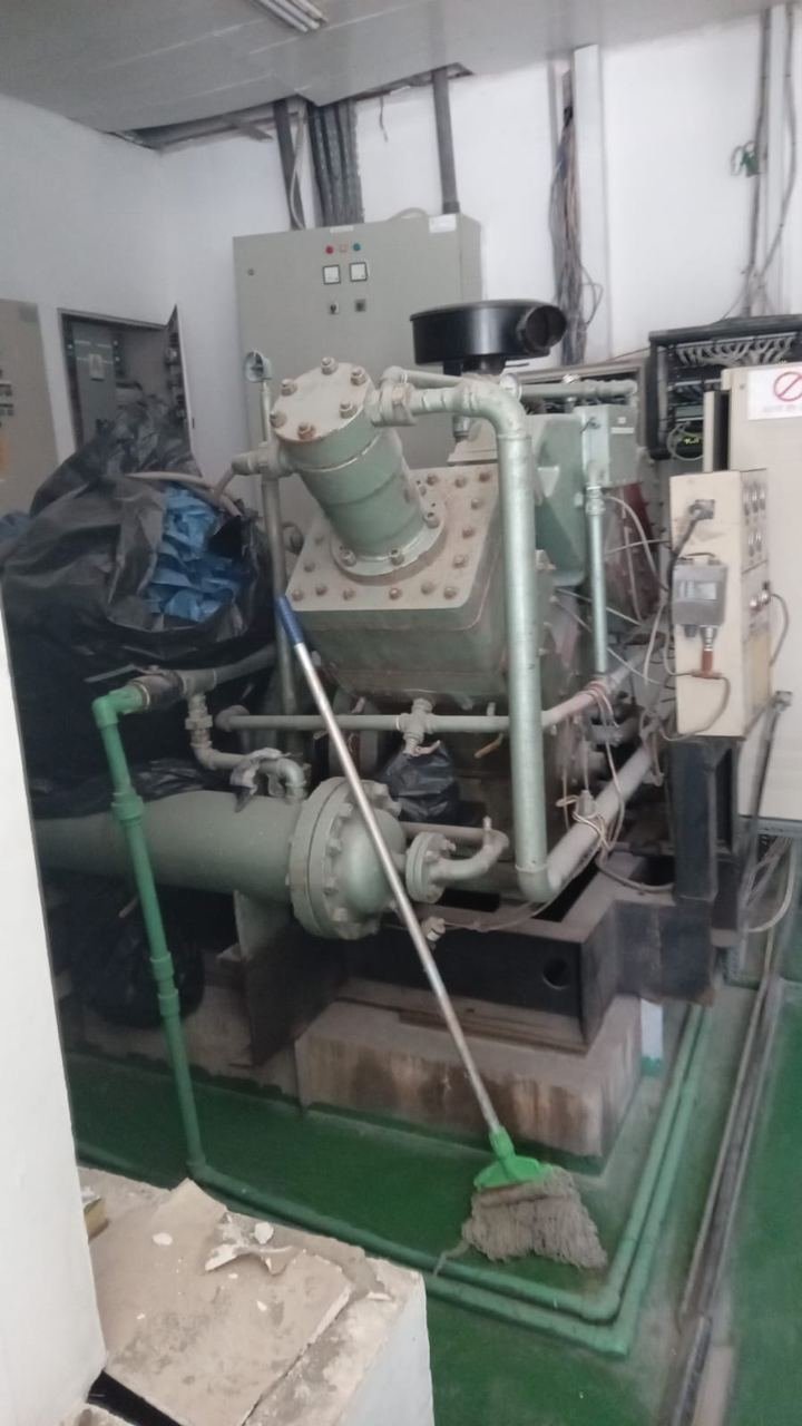 Large industrial compressor unit with pipework in a plant room